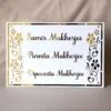 nameplate with floral design in white and gold, rectangle shape with 3 customizable names option