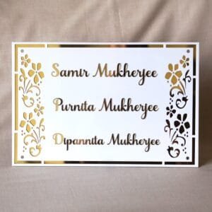 nameplate with floral design in white and gold, rectangle shape with 3 customizable names option