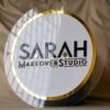 business signboard in white and golden color with 3d embossed letters and transparent border