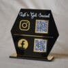 quick response scan stand in black and gold lets get social written on the scan stand