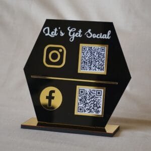 quick response scan stand in black and gold lets get social written on the scan stand