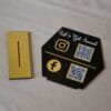 quick response scan stand in black and gold lets get social written on the scan stand