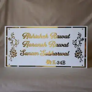 acrylic nameplate with floral design on side and house number in white and gold color in rectangle shape