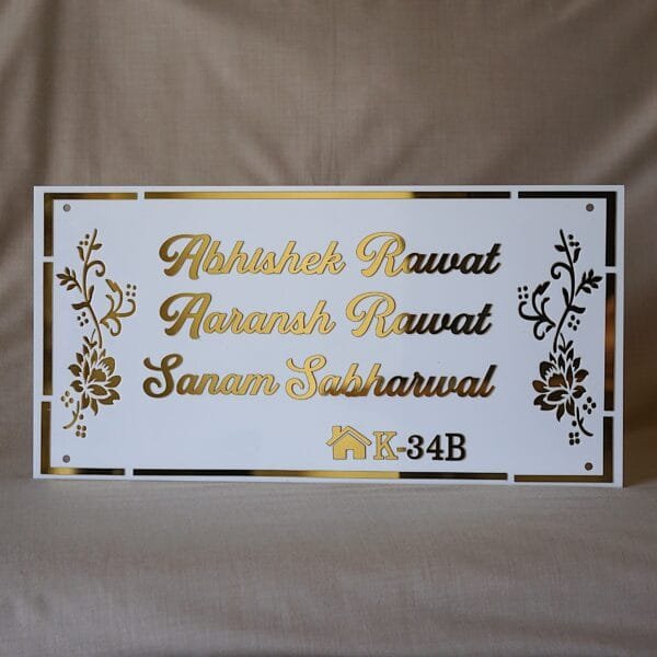 acrylic nameplate with floral design on side and house number in white and gold color in rectangle shape