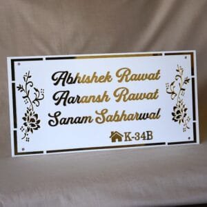 acrylic nameplate with floral design on side and house number in white and gold color in rectangle shape