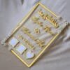 nikah thumb board in transparent and golden color. square design with embellishments on diagonal corners.