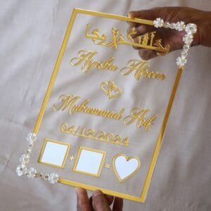 nikah thumb board in transparent and golden color. square design with embellishments on diagonal corners.