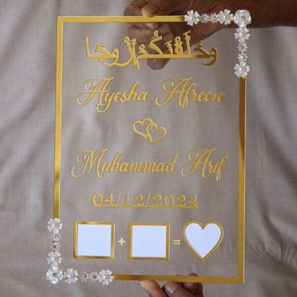 nikah thumb board in transparent and golden color. square design with embellishments on diagonal corners.