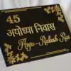 Devanagari Font Name Plate in black and gold with room number and floral design