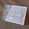 Rectangular white and gold nameplate with floral design, customizable name option.