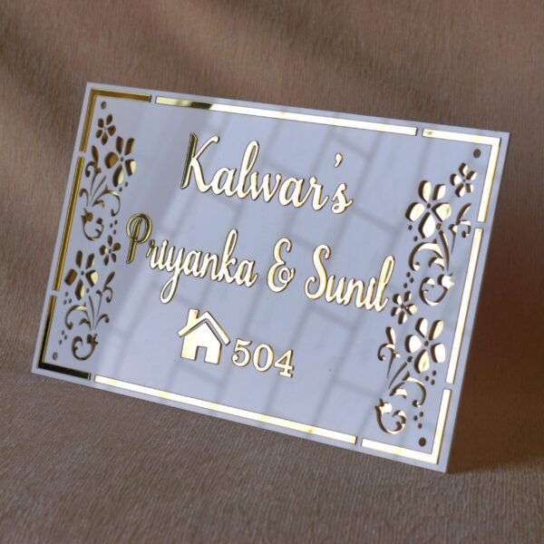 Rectangular white and gold nameplate with floral design, customizable name option.