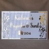 Rectangular white and gold nameplate with floral design, customizable name option.