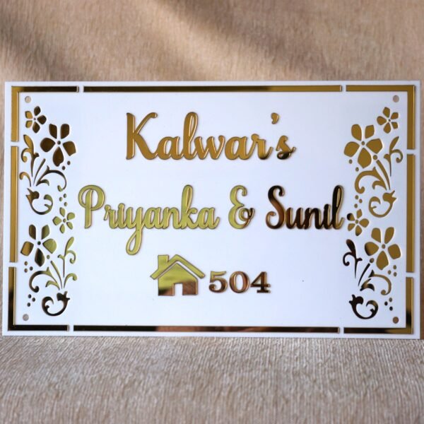 Rectangular white and gold nameplate with floral design, customizable name option.