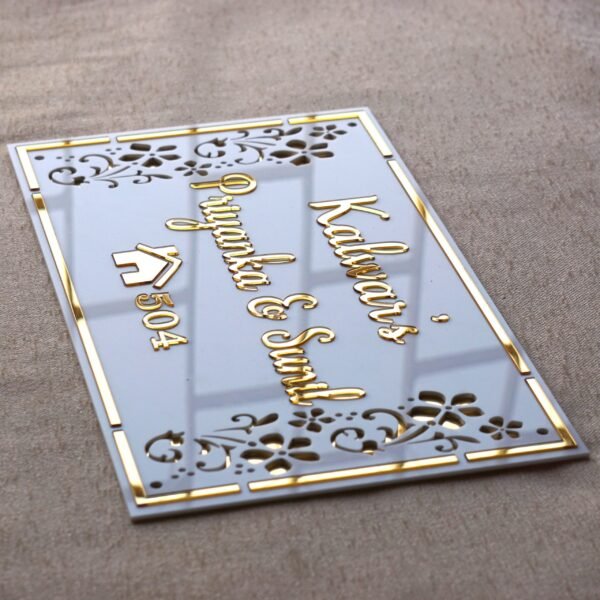 Rectangular white and gold nameplate with floral design, customizable name option.