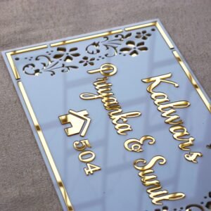 Rectangular white and gold nameplate with floral design, customizable name option.