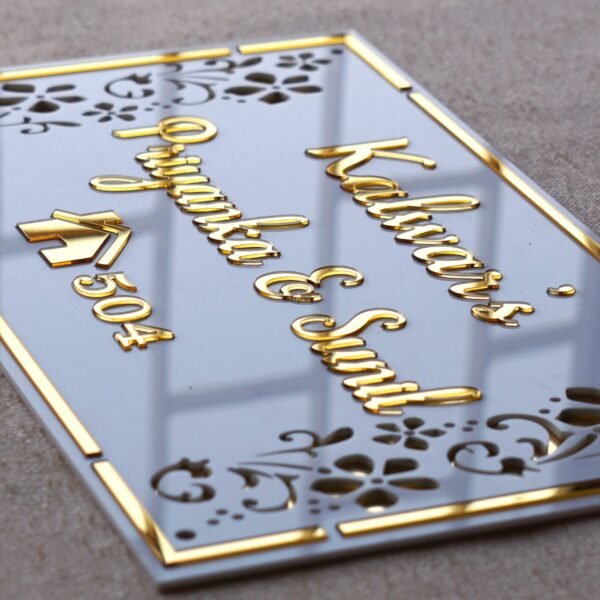 Rectangular white and gold nameplate with floral design, customizable name option.
