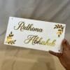 Personalized Acrylic Name Plate in white and gold with leaf design on diagonal corners