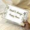 nameplate with floral design in white and gold, rectangle shape with 2 customizable names option