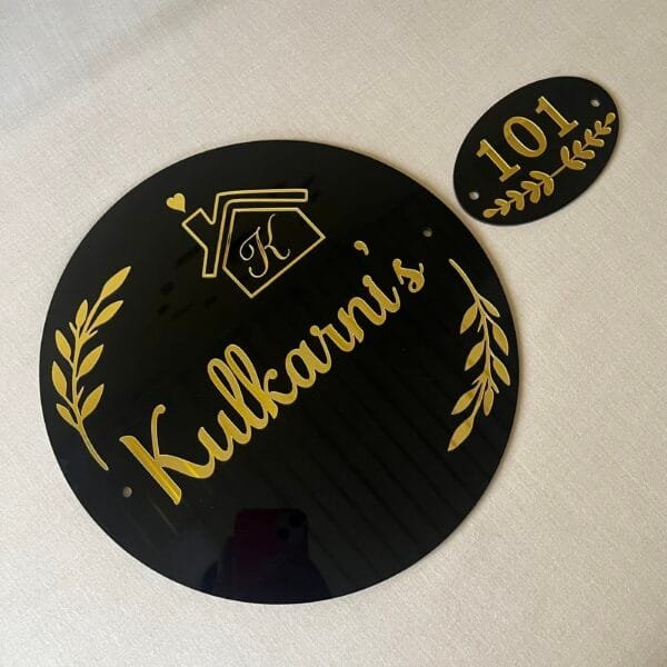 acrylic nameplate with numberplate in black and gold color and round shape