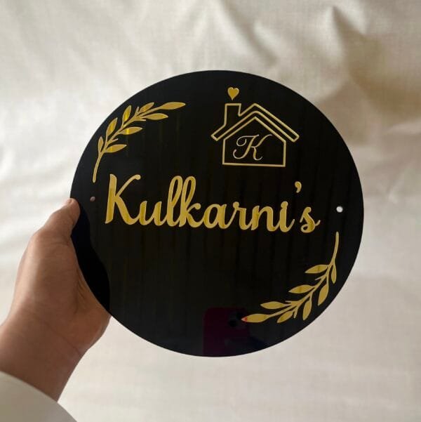 acrylic nameplate with numberplate in black and gold color and round shape