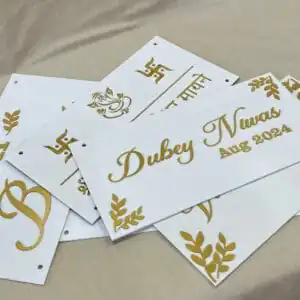 multiple Personalized Acrylic Name Plates in white and gold with leaf design on diagonal corners