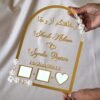 in hand photo of nikah thumb board in golden color with floral embellishments