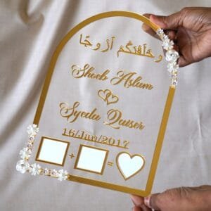 in hand photo of nikah thumb board in golden color with floral embellishments