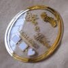 round nikah thumb plate for wedding ceremony made using golden and transparent acrylic sheets, the size of this product is 10 by 10 inches