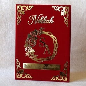 Nikah Invitation Booklet Made using red velvet and golden acrylic, the size of the product is 14 by 12 inches.