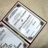 Personalized Nikah Nama Booklet with customized initials design inside photo