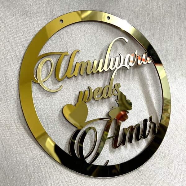 IMG_1284 Golden round wall hanging with couple's name. Acrylic and MDF.