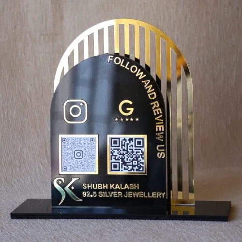 Acrylic QR stand with a golden grilled background for a premium look, this QR code stand is used for connecting with clients on social media and receiving payments seamlessly.