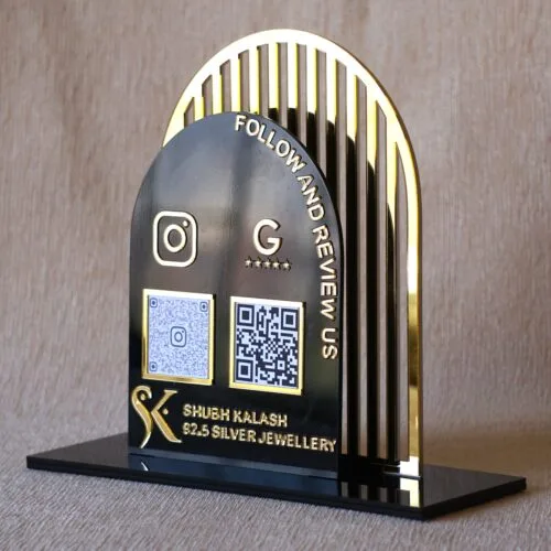 Acrylic QR stand with a golden grilled background for a premium look, this QR code stand is used for connecting with clients on social media and receiving payments seamlessly.