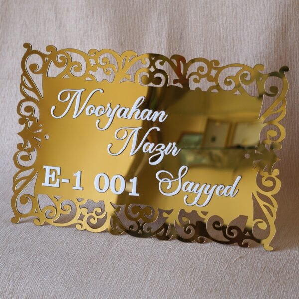 1741871521196 The acrylic nameplate for the home in a Victorian-style border is made using acrylic and MDF for durability, and a golden acrylic sheet is used for royal looks. This nameplate will be a perfect statement piece for the home entrance.