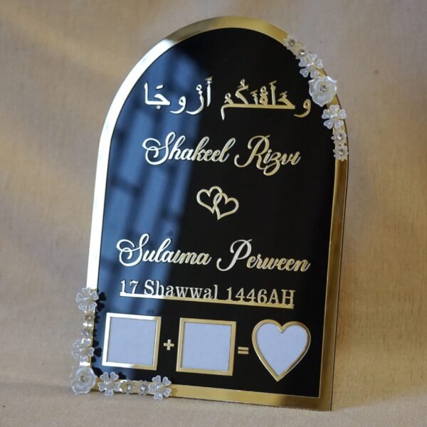Black and gold acrylic Nikah thumb board with customizable names, ideal for Muslim wedding ceremonies.