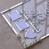 Transparent & silver acrylic personalized wedding thumbprint frame with floral corner embellishments, embossed bride and groom names and date, plus dedicated thumbprint spaces.