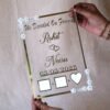 Transparent & silver acrylic personalized wedding thumbprint frame with floral corner embellishments, embossed bride and groom names and date, plus dedicated thumbprint spaces.