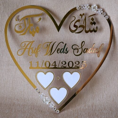 heart shape nikah thumb in golden color with floral embellishments. The size of this nikah thumb board is 12 by 12 inches. This can be used to add a special moment to the wedding, and it can also be kept as a wedding keepsake.