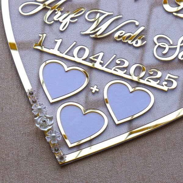 DSC07602 heart shape nikah thumb in golden color with floral embellishments. The size of this nikah thumb board is 12 by 12 inches. This can be used to add a special moment to the wedding, and it can also be kept as a wedding keepsake.