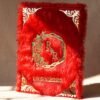 A red fur–clad nikah nama booklet with an acrylic cover and MDF backing, opened to blank pages for the bride’s and groom’s thumbprints and signatures as a lasting wedding keepsake