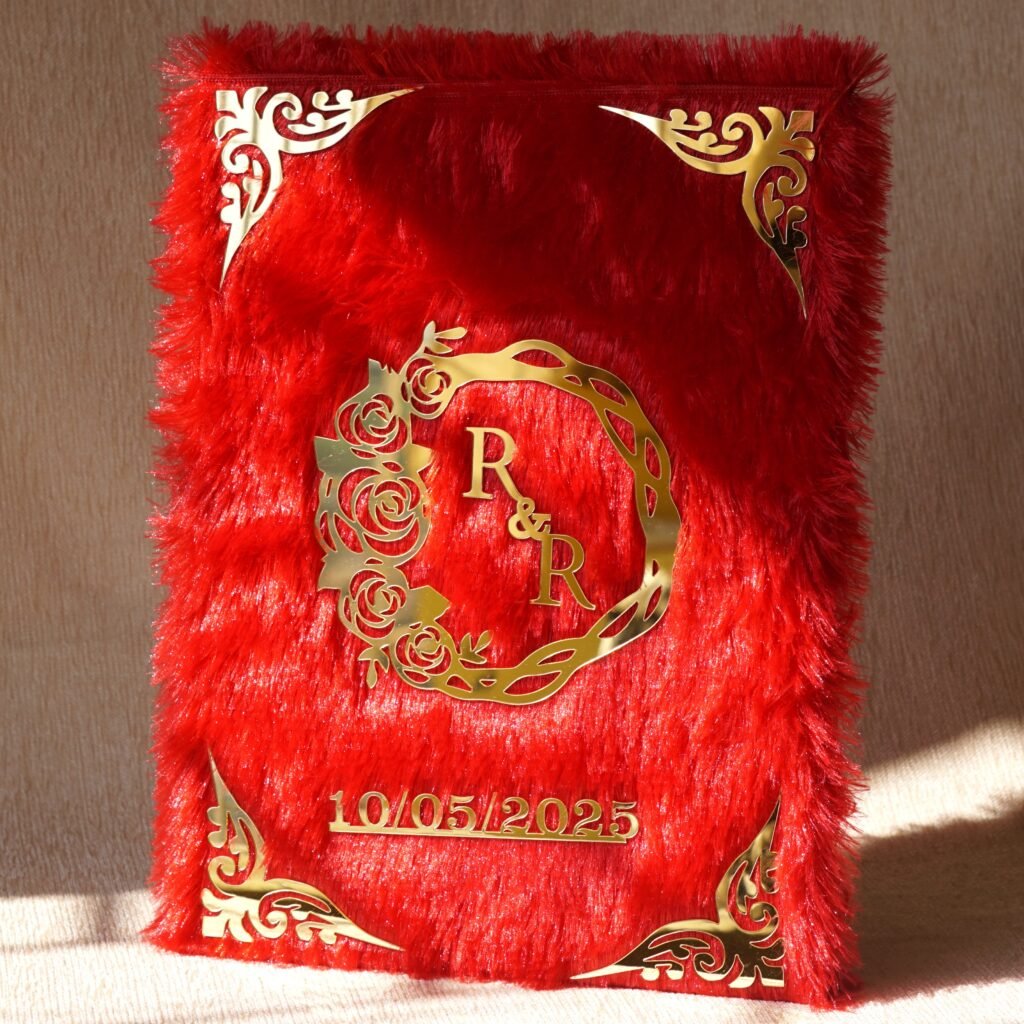 A red fur–clad nikah nama booklet with an acrylic cover and MDF backing, opened to blank pages for the bride’s and groom’s thumbprints and signatures as a lasting wedding keepsake