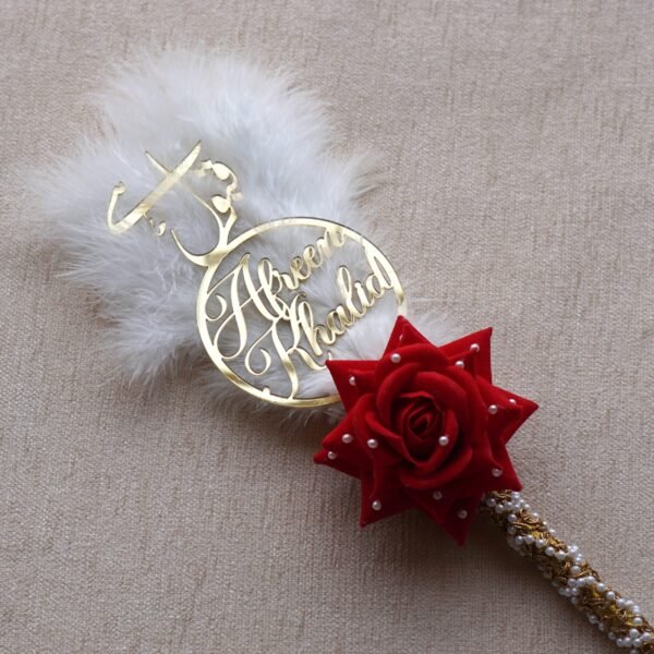 "Customizable Nikah pen adorned with feathers, decorative lace, a rose, and a personalized acrylic name cutout—ideal for signing the Nikah Nama.