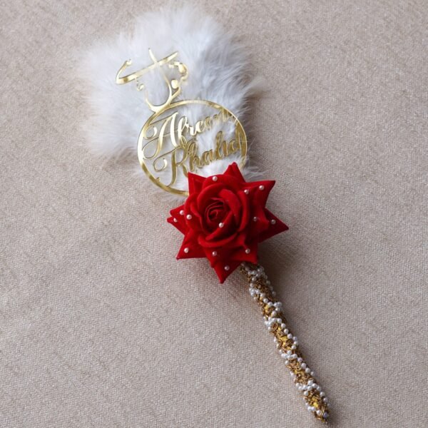"Customizable Nikah pen adorned with feathers, decorative lace, a rose, and a personalized acrylic name cutout—ideal for signing the Nikah Nama.