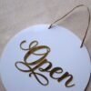 Round 10x10 inch open closed signboard for shop, office, or business, made of durable acrylic in golden and white for a premium look.