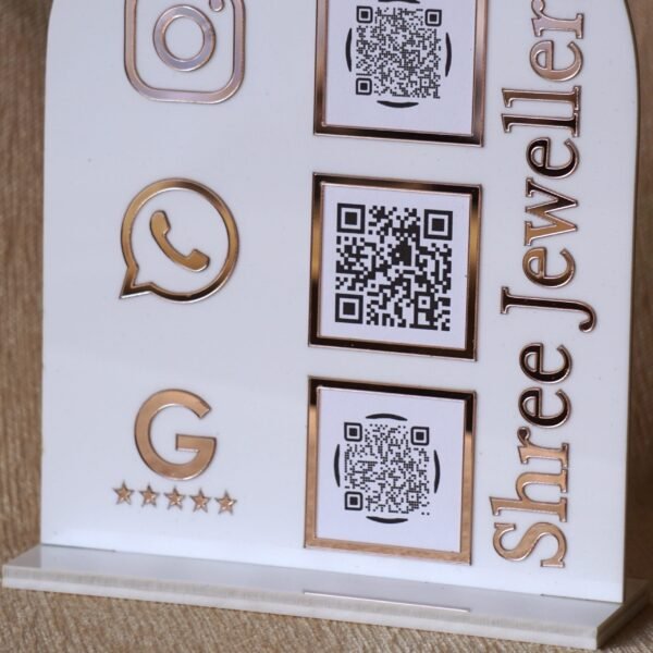 Personalized dome-shaped QR code scanner stand made using rose gold and white acrylic sheet with 3 QR code options and personalized brand name written on the side.