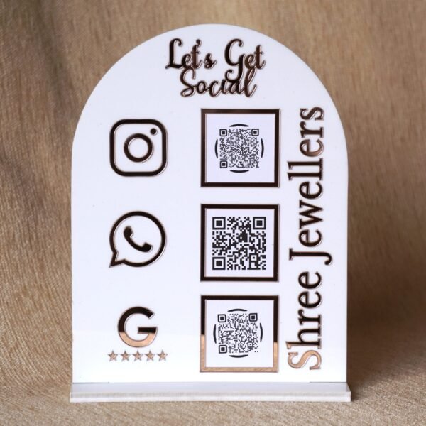 Personalized dome-shaped QR code scanner stand made using rose gold and white acrylic sheet with 3 QR code options and personalized brand name written on the side.