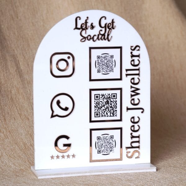 DSC07510 Personalized dome-shaped QR code scanner stand made using rose gold and white acrylic sheet with 3 QR code options and personalized brand name written on the side.