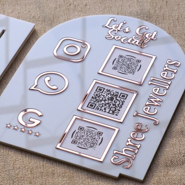 DSC07512 Personalized dome-shaped QR code scanner stand made using rose gold and white acrylic sheet with 3 QR code options and personalized brand name written on the side.