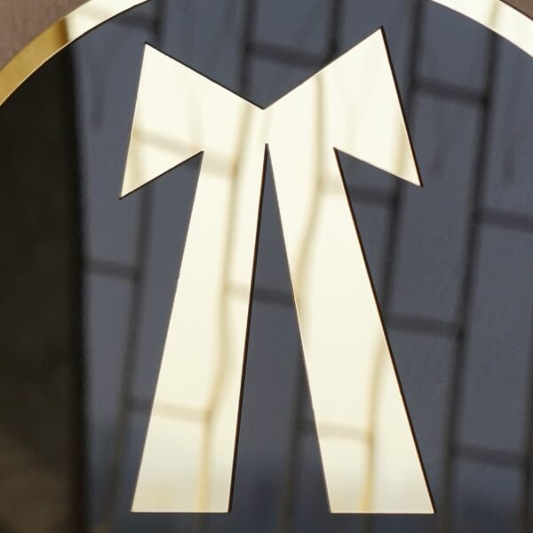 Round 3D embossed advocate signboard, which features a logo. The color combination of this signboard is black and gold, which gives a professional look to the lawyer's office.