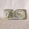 Front view of the 'Happy Raksha Bandhan' acrylic money envelope with gold lettering and a decorative rakhi icon, perfect for gifting cash on the auspicious occasion.